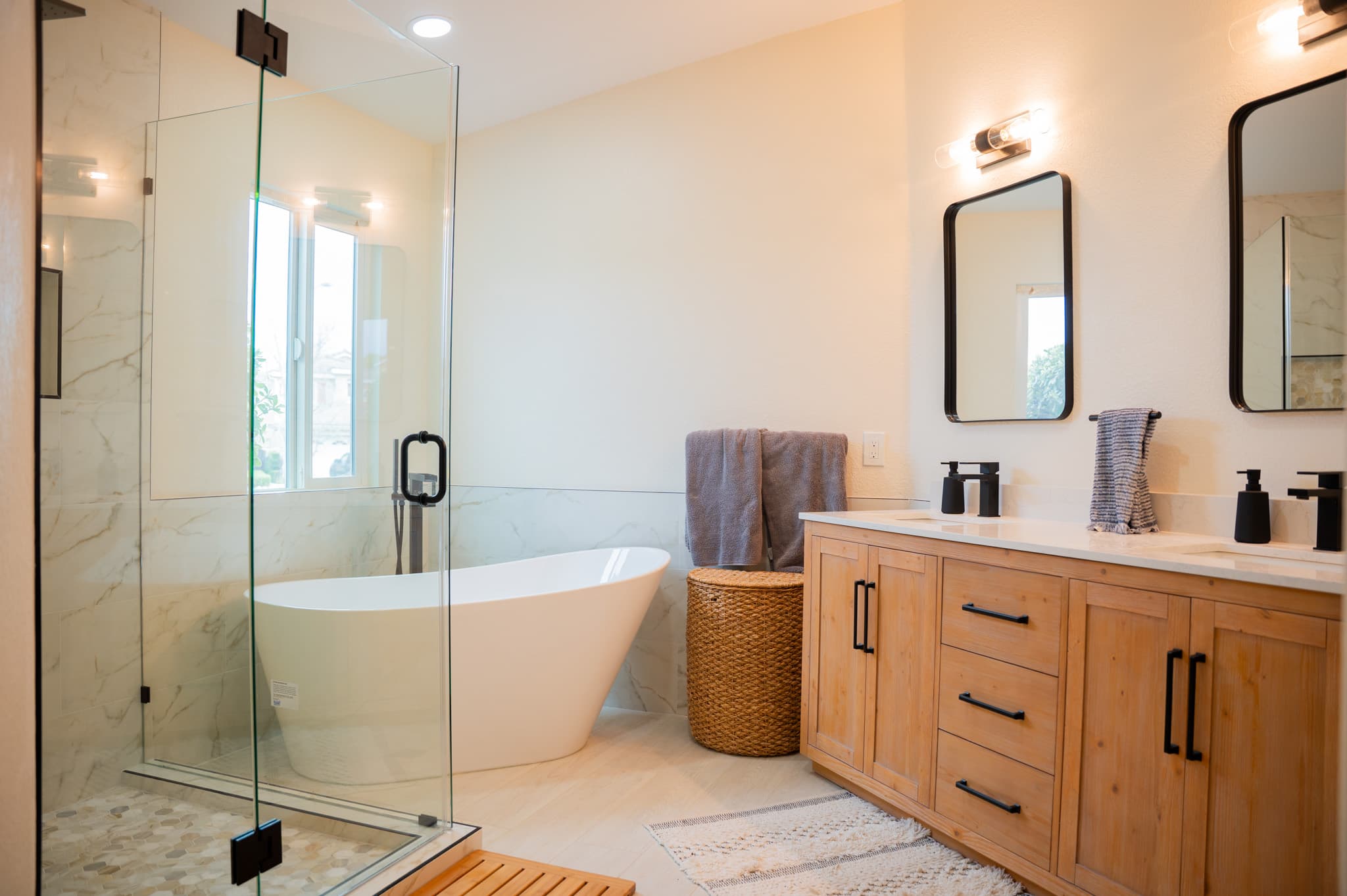 Spa-like bathroom with shower and bathtub in San Diego