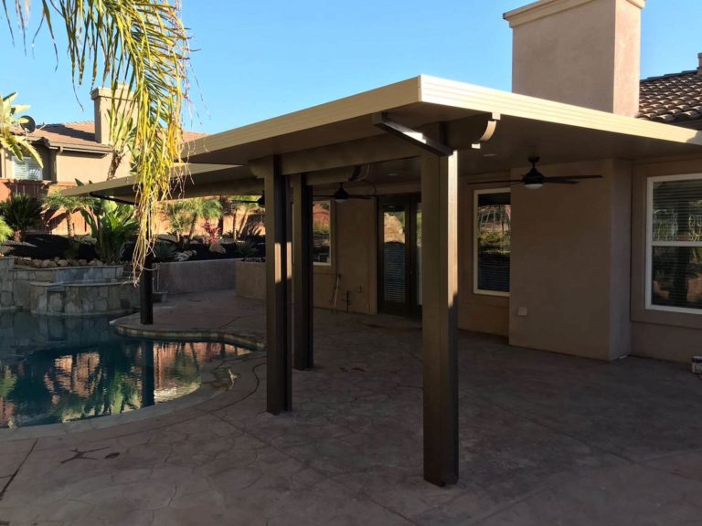Tan Patio Cover in Backyard next to pool