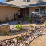Modern patio with retaining walls and low-maintenance landscaping