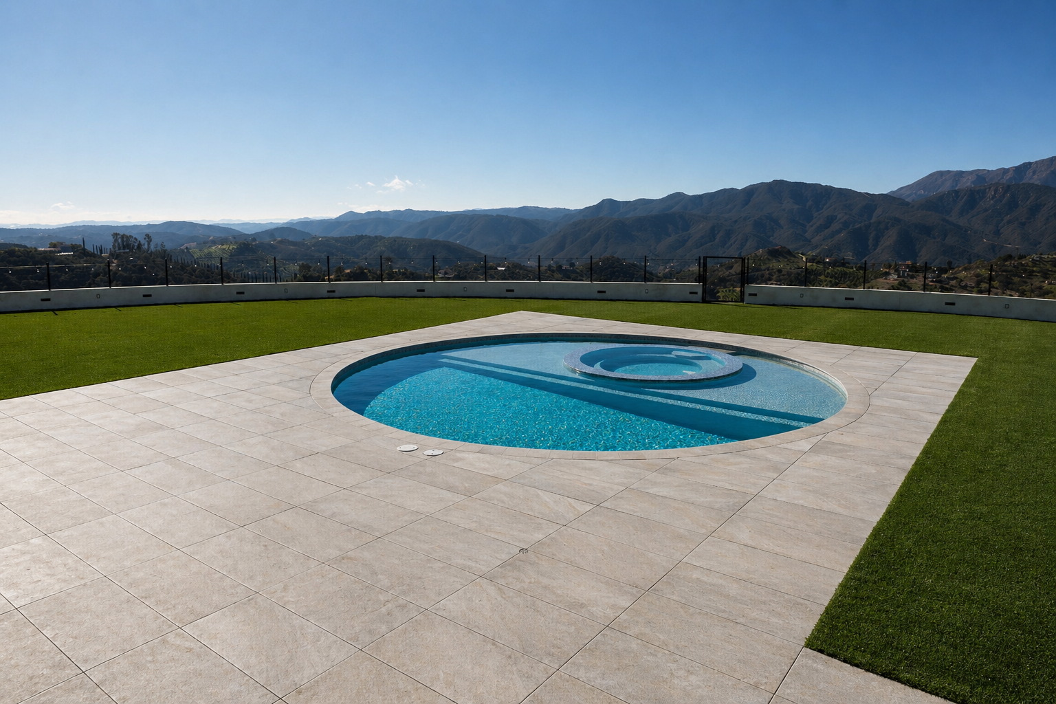 Pavers around pool area surrounded by artificial turf